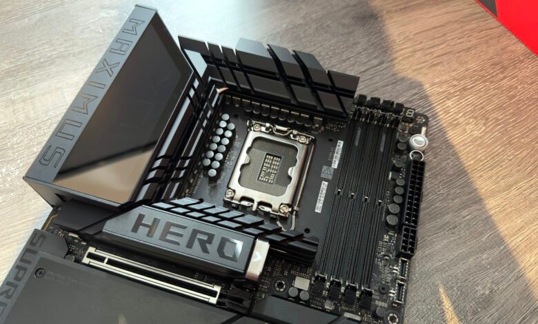 Close-up of a black ASUS ROG Maximus Hero motherboard, showcasing its CPU socket, RAM slots, and integrated I/O shield.