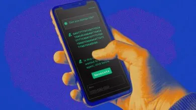 Hand holding smartphone displaying a DNA sequence generator app, asking 'Can you design life?', with a 'Generate' button.