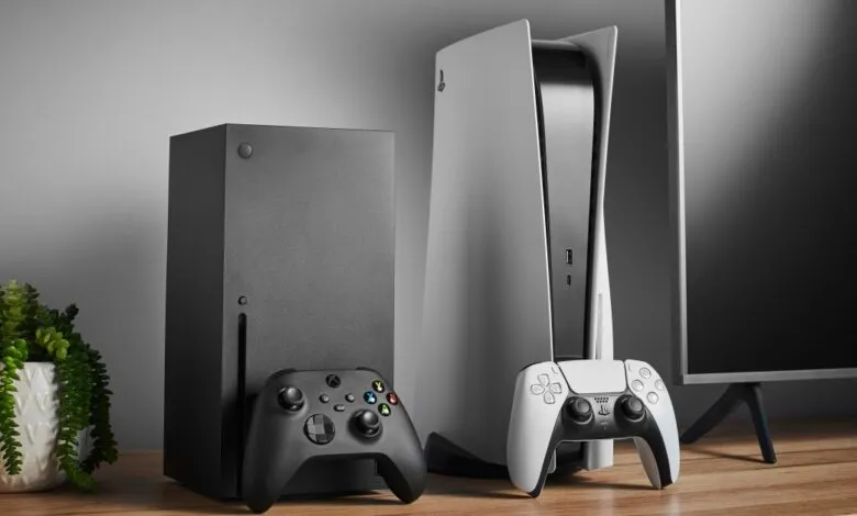Xbox Series X and PlayStation 5 consoles with controllers, next to a TV.