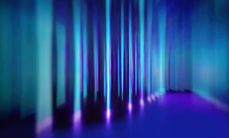 Abstract digital art featuring vibrant teal, purple, and blue vertical light streaks in a dark space.