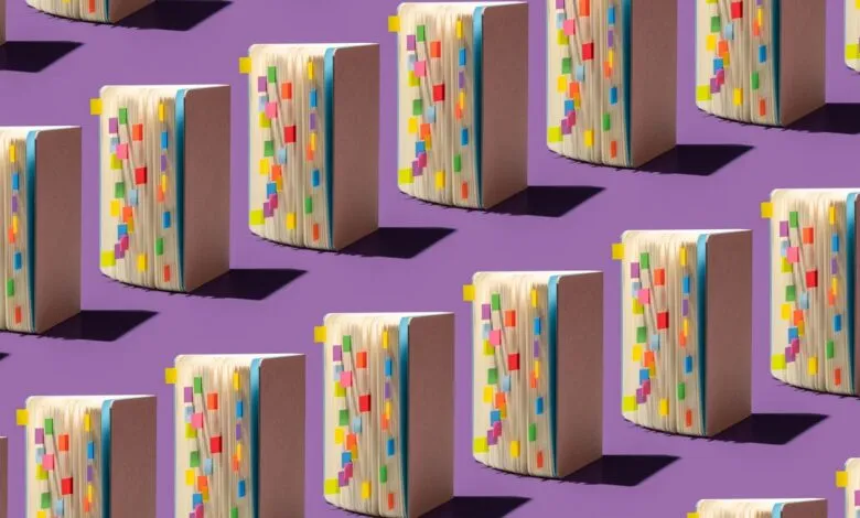 Repeating pattern of open notebooks with colorful sticky notes on a purple background.