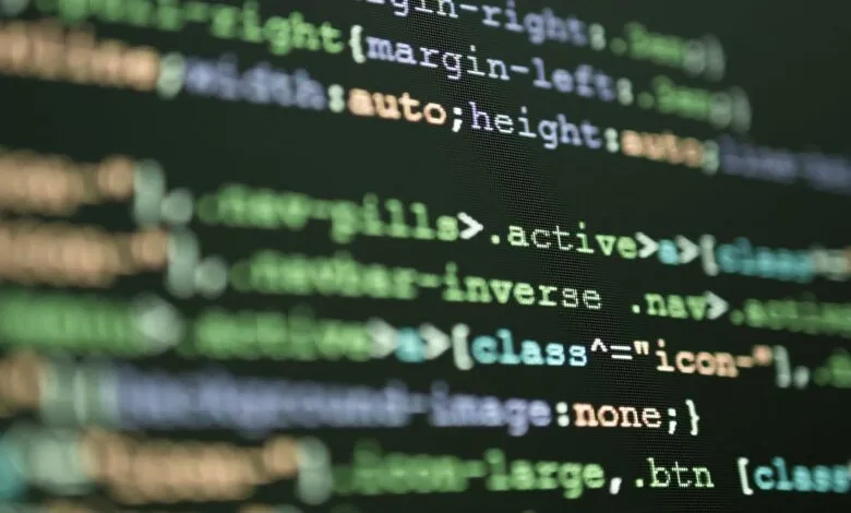 Close-up of computer code on a screen, showcasing lines of text in various colors.