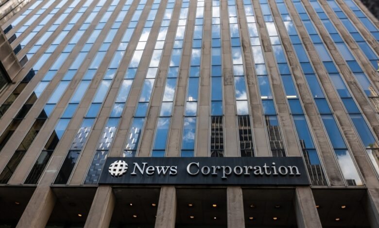 News Corporation building exterior, showcasing its logo and modern architecture with reflective windows.