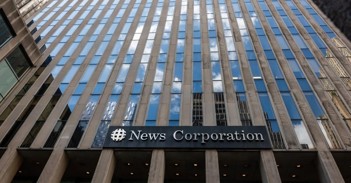 News Corporation building exterior, showcasing its logo and modern architecture with reflective windows.
