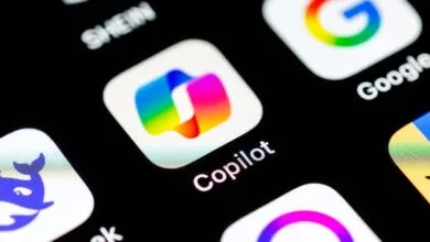 Close-up of a smartphone screen showing the Copilot app icon among other apps.