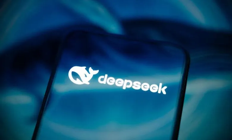 DeepSeek logo displayed on a smartphone screen against a blurred blue background.