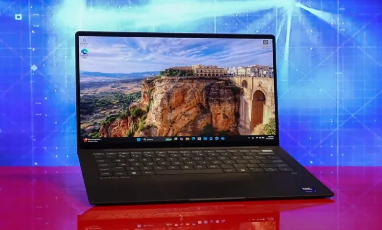 Black HP EliteBook Ultra laptop displaying a scenic landscape wallpaper with a bridge.