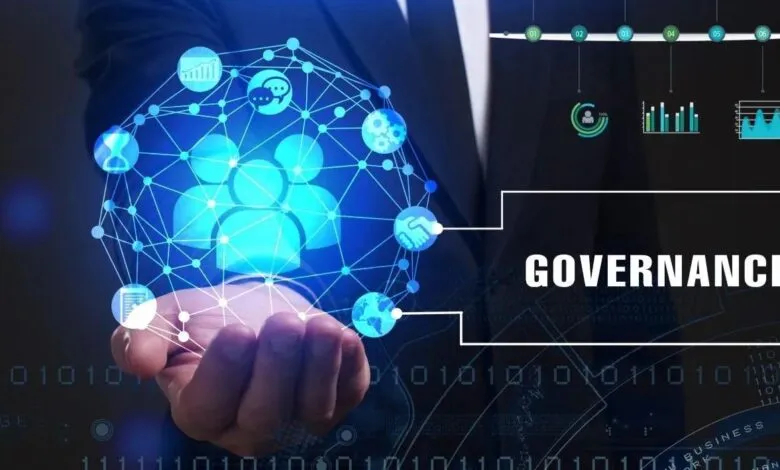 Person holding a glowing network graphic representing corporate governance, showing interconnected icons of people, graphs, and a handshake.