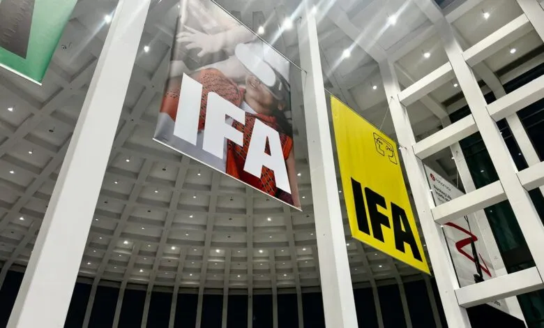 IFA Berlin trade show banners hanging in a modern building's atrium.