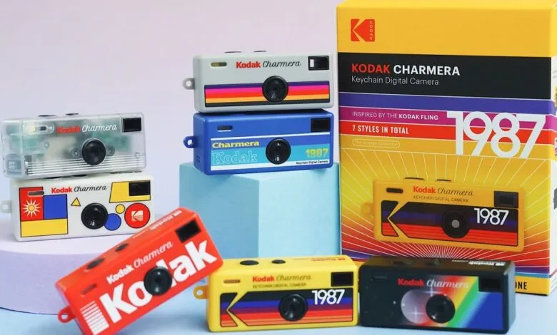 Seven vintage-style Kodak Charmera keychain digital cameras in various colors and designs.
