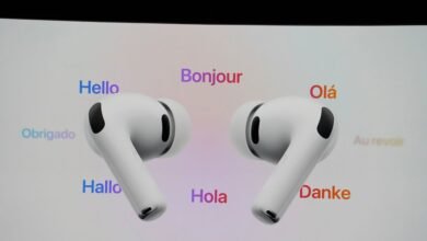 Pair of white Apple AirPods Pro displayed on screen with multilingual greetings.