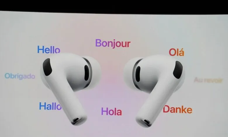 Pair of white Apple AirPods Pro displayed on screen with multilingual greetings.