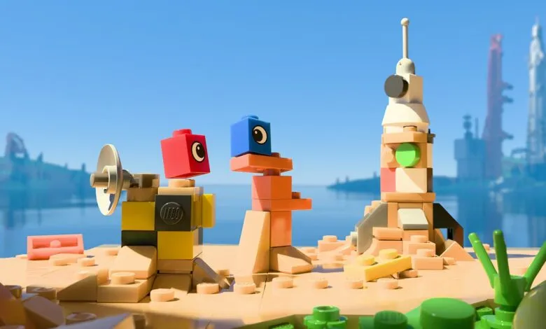 Lego figures on a beach, watching a rocket launch. Bright, playful scene.