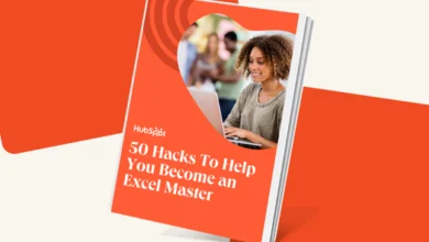 HubSpot ebook cover: 50 Excel hacks to master spreadsheets. Woman smiles while working on laptop.