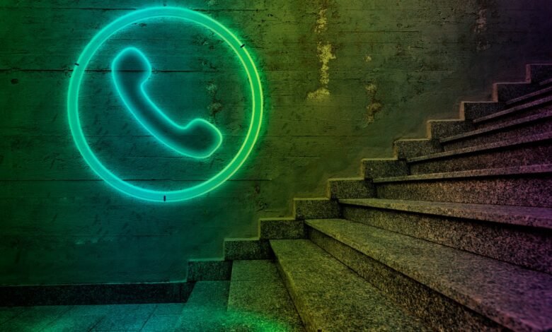 Neon green phone icon in a circle on a textured wall next to a granite staircase.
