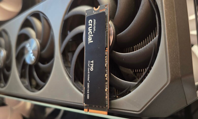 Crucial T710 PCIe Gen5 NVMe M.2 SSD rests atop a Zotac graphics card.