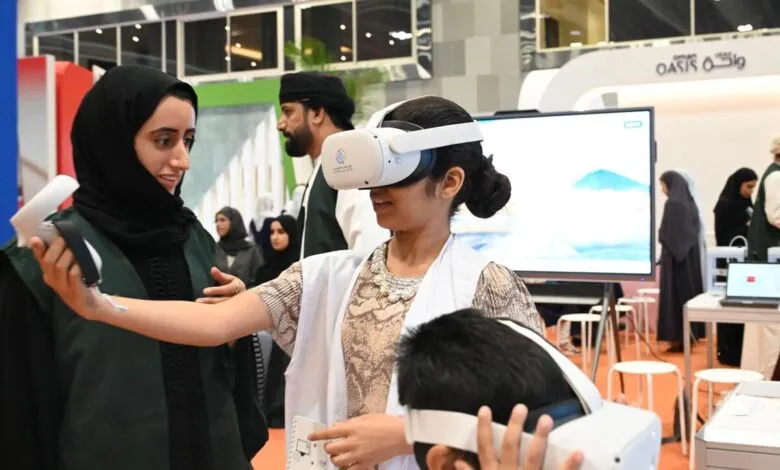 Children and adults experience virtual reality headsets at a tech expo in Oman.