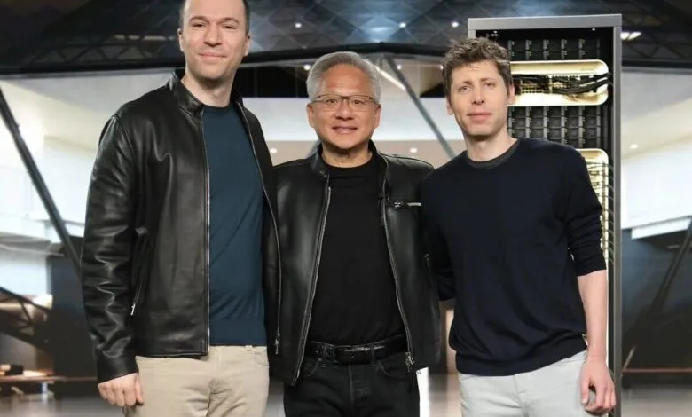 Sam Altman, Jensen Huang, and Greg Brockman stand together, smiling.