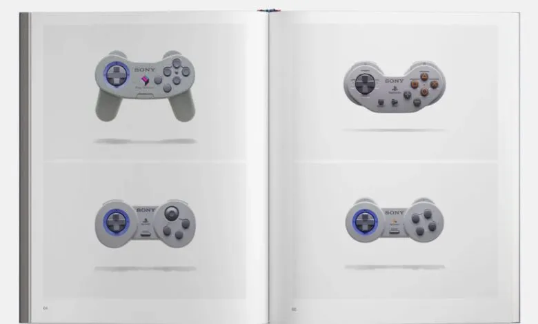 Four classic Sony PlayStation controllers displayed on a white background.