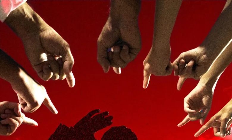 Multiple hands pointing downwards at a shadowed figure on a red background, symbolizing blame or judgment.