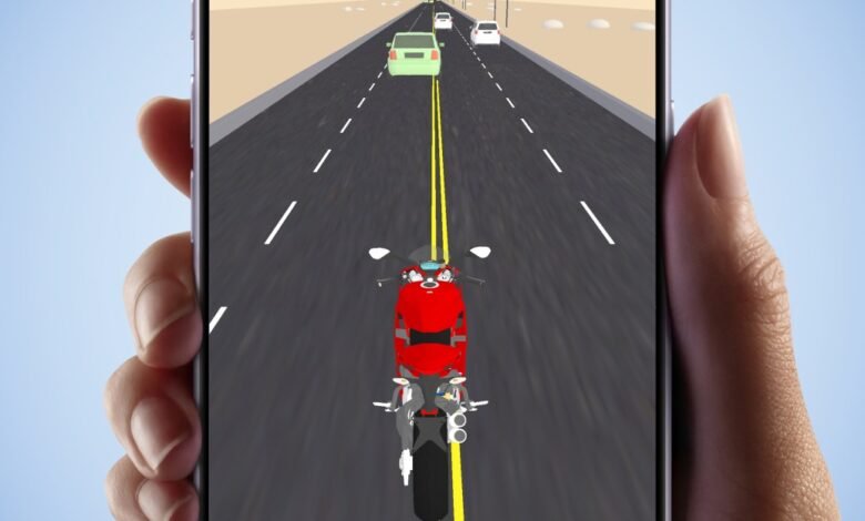 Close-up of a hand holding a smartphone displaying a motorcycle racing game.