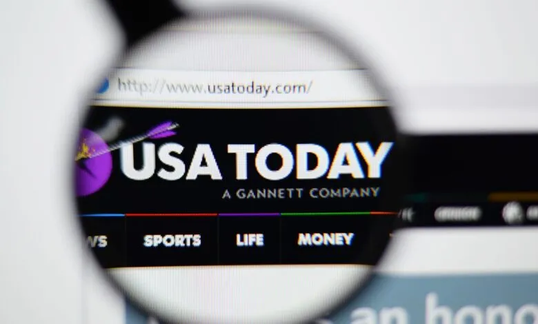 Close-up of USA Today website homepage, showing logo and navigation.