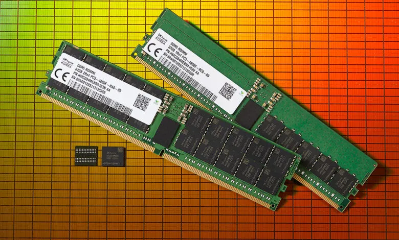 Three green DDR5 RAM modules and two smaller memory chips rest on a gridded orange surface. Close-up product shot.