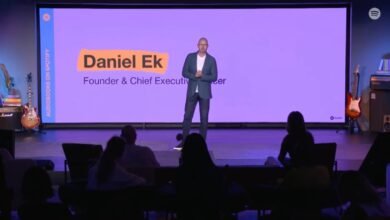 Daniel Ek, Founder & CEO of Spotify, presents on stage with a purple background.