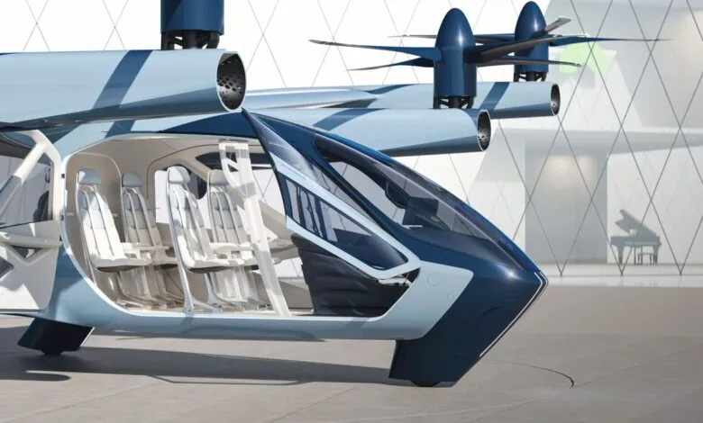 Interior view of a futuristic electric vertical takeoff and landing (eVTOL) aircraft with white seats.