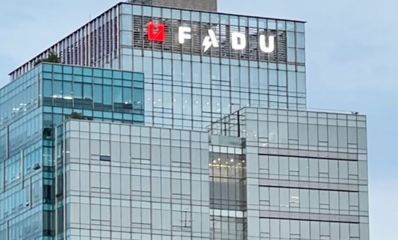 FADUU logo displayed prominently on a modern glass skyscraper.