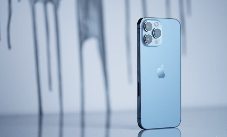 Close-up of a light blue iPhone 12 Pro Max, showcasing its sleek design and triple-lens camera.