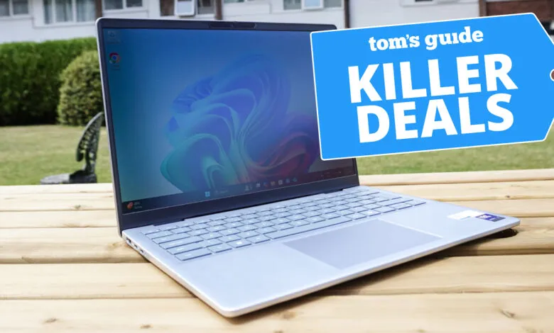 Silver laptop outdoors displaying Windows 11, with a Tom's Guide 'Killer Deals' tag.