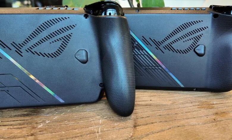 Close-up of two ASUS ROG Ally handheld gaming consoles, showcasing their sleek black design and textured grips.