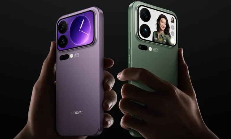 Hands holding two Xiaomi smartphones, one purple and one green, showcasing their camera modules.