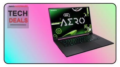 Gigabyte Aero laptop with vibrant green and pink accents, showcased against a gradient background.