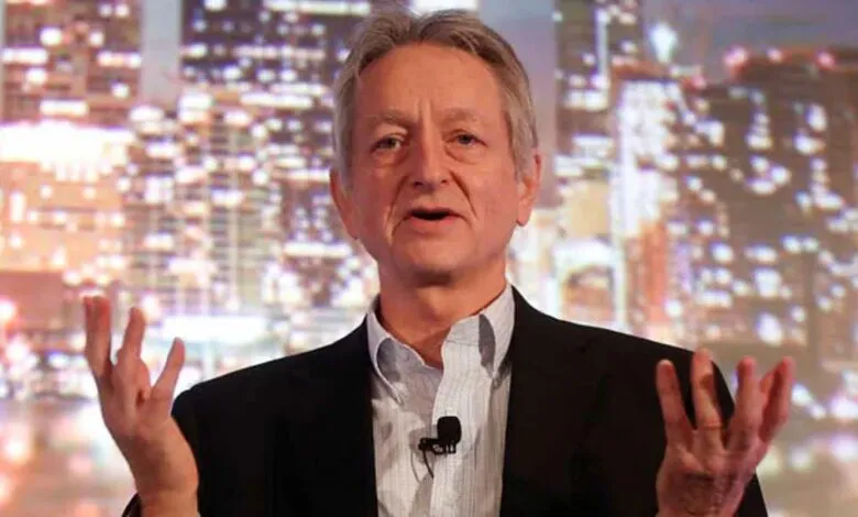 John Chambers, former Cisco CEO, speaks at a conference, gesturing with his hands against a blurred city backdrop.
