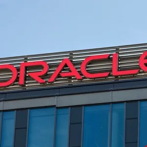 Close-up of the red Oracle logo on the side of a modern building.