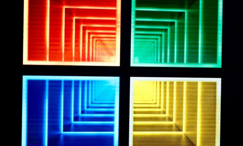 Four abstract geometric tunnels in red, green, blue, and yellow light.