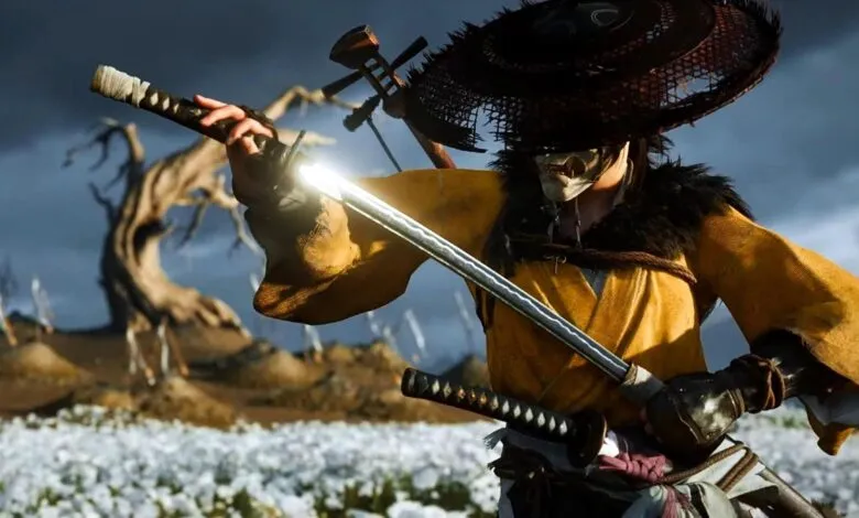Samurai warrior in yellow robes and mask draws a glowing katana in a field of white flowers.