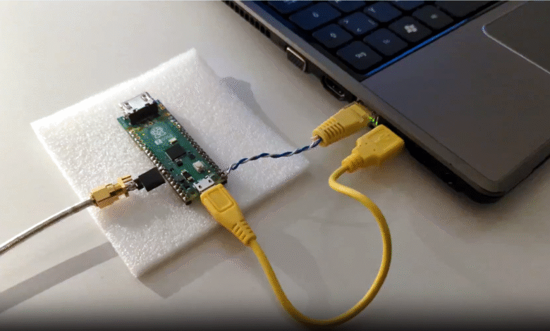 Raspberry Pi Pico microcontroller connected to a laptop via USB.