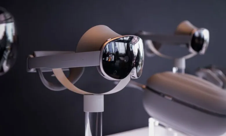 Close-up of a sleek, white virtual reality headset with a reflective visor.