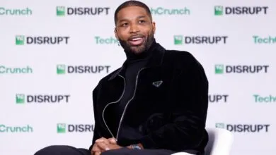 Tristan Thompson smiles while sitting on a white chair at a TechCrunch Disrupt event.