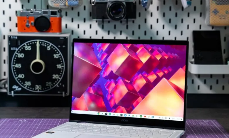 Close-up of an Acer Chromebook Plus Spin 514 laptop with a vibrant abstract wallpaper.