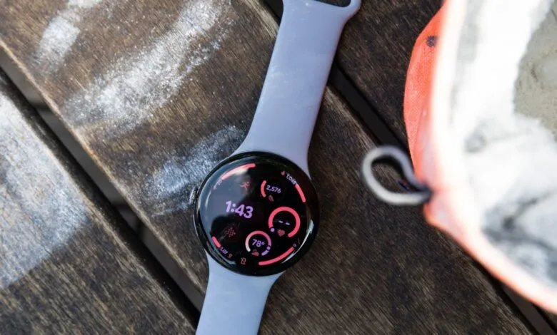 Close-up of a Google Pixel Watch with a light purple band displaying fitness metrics.