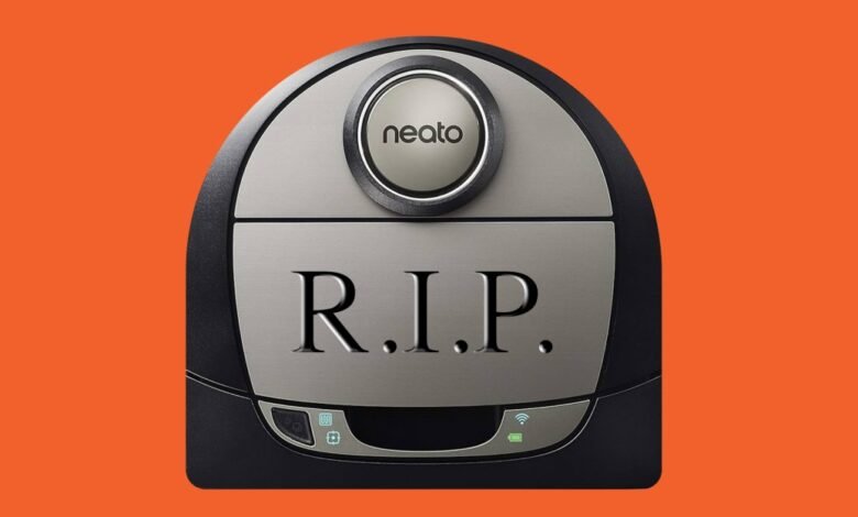 A Neato robot vacuum cleaner with 'R.I.P.' engraved on its surface.