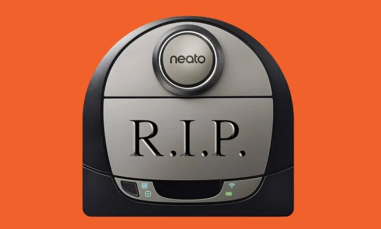 A Neato robot vacuum cleaner with 'R.I.P.' engraved on its surface.