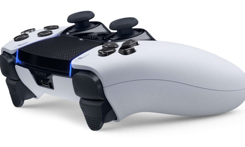 Close-up of a white Sony DualSense PlayStation 5 controller on a white background.