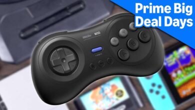 Black 8BitDo M30 game controller with retro gaming graphics in the background.