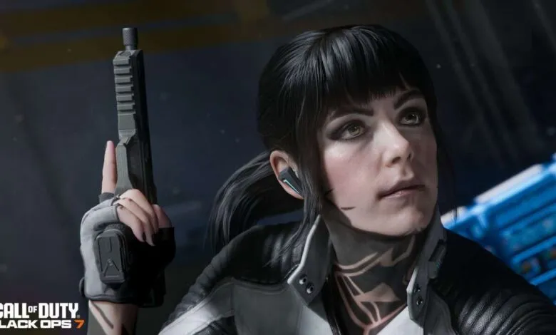 A woman with dark hair and tactical gear holds a handgun, looking intently to the side.