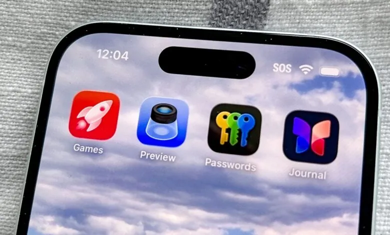 Close-up of an iPhone screen showing app icons: Games, Preview, Passwords, and Journal.